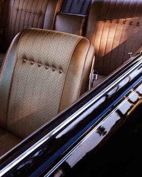 pexels photo 33830606 33830606 Close-up of a classic car's vintage interior featuring tan leather seats with retro design.
