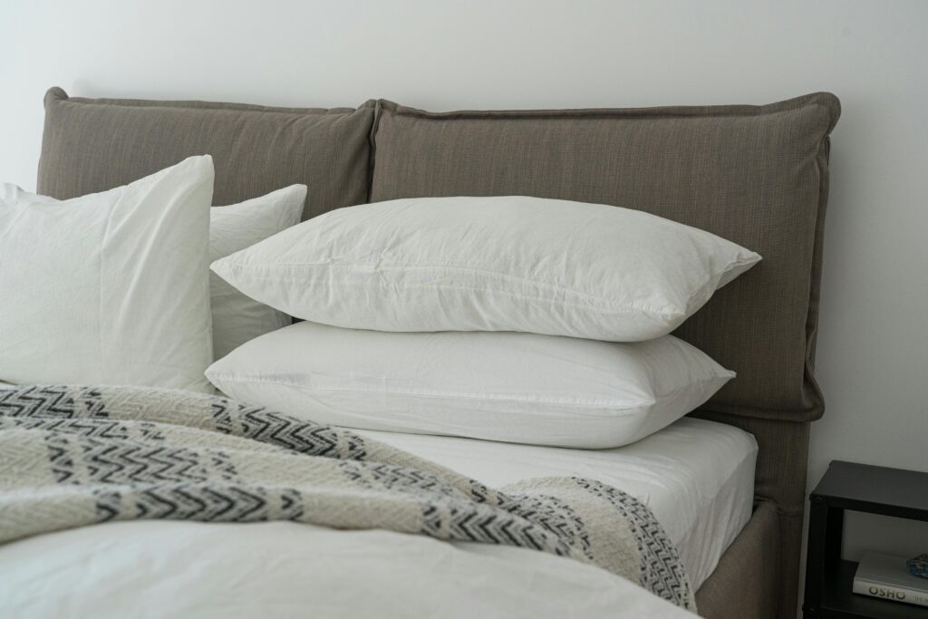 pexels photo 3682240 3682240 Modern bedroom featuring clean white bedding and pillows for a cozy and inviting atmosphere.