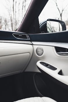 pexels photo 3778766 3778766 Luxurious car interior featuring white leather and sleek design with a view of the side mirror.